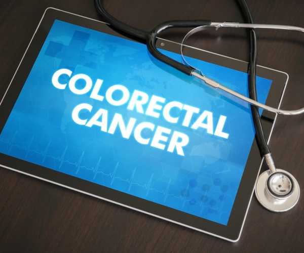 'Colon Cancer' on screen of tablet, stethoscope