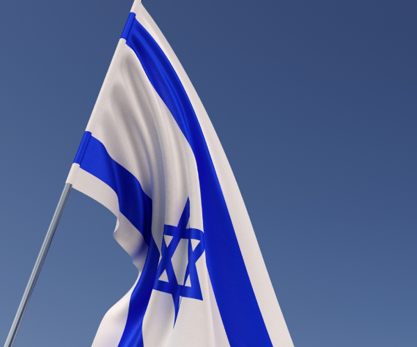 an israeli flag against the clear sky