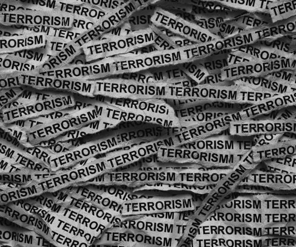 strips of paper filling the entire picture with terrorism written on them