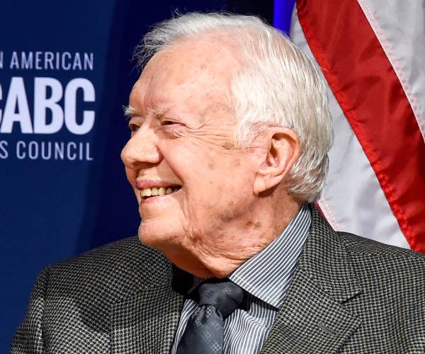 jimmy carter smiles during a convention