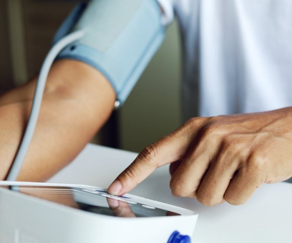 person taking their blood pressure