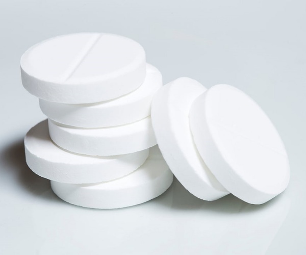 close-up of several low-dose aspirin tablets