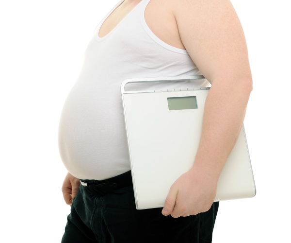 obese man in white t-shirt, black pants, carrying a scale