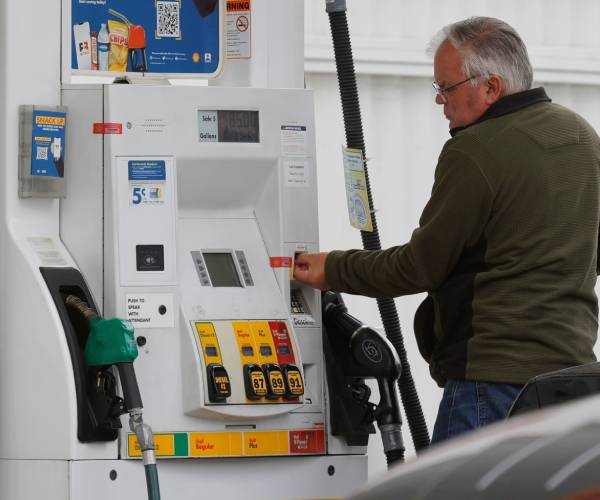 a man at a gas pump