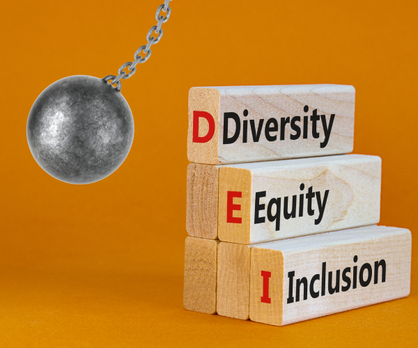 a wrecking ball hitting blocks reading diversity equity and inclusion