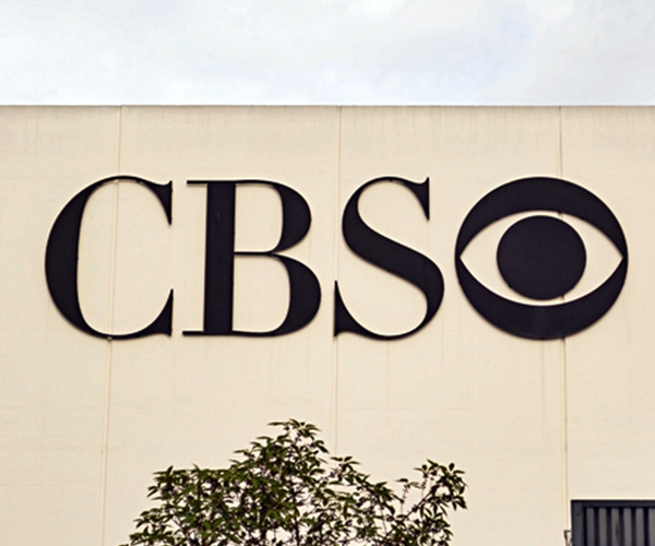 cbs logo in black is shown outside of building 