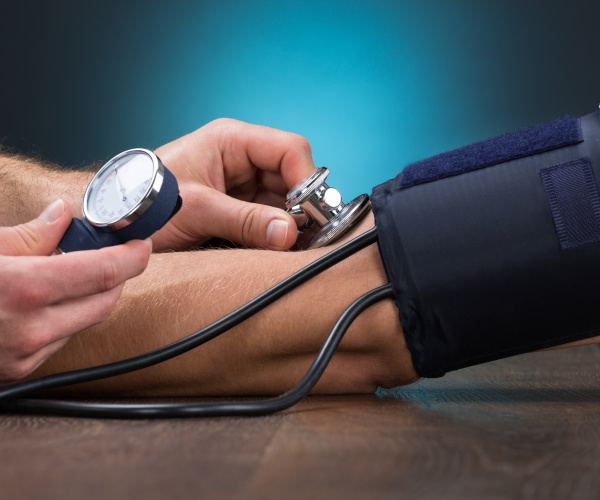 person getting their blood pressure taken