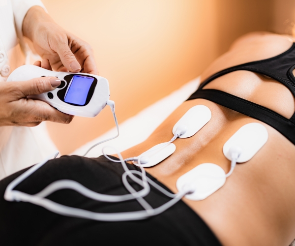 lower back physical therapy with tens electrode pads