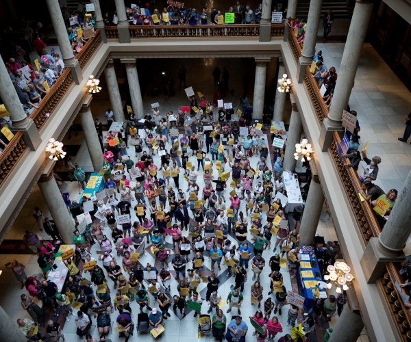 Abortion rights supporters rally at the Statehouse in Indianapolis on Monday