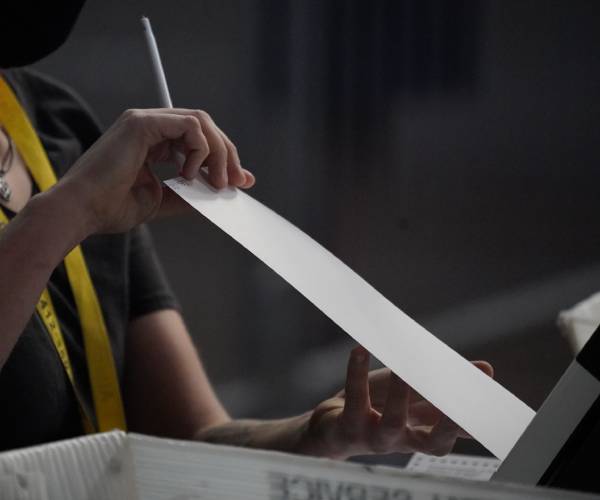 a ballot being counted