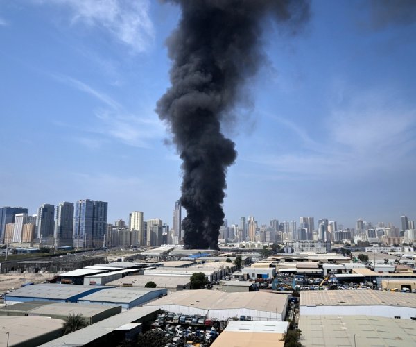 smoke rising over a city