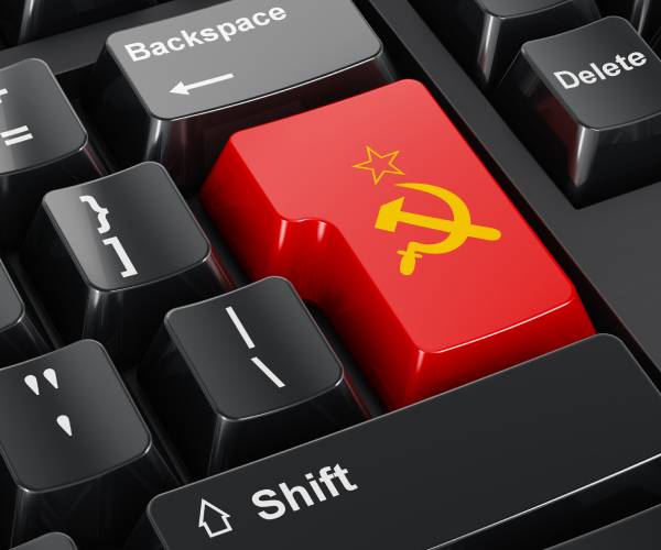 a computer keyboard with a key with a hammer and sickle on it