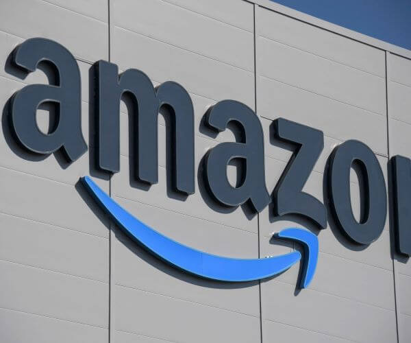 Wall St Closes Higher as Amazon's Growth Offsets Tepid Jobs Growth