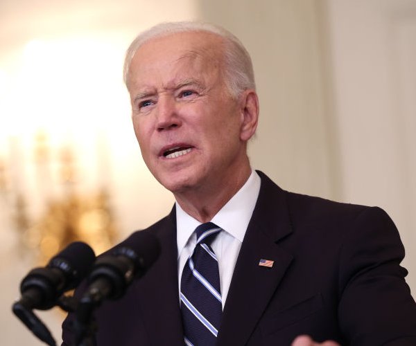 Biden speaking, dark suit