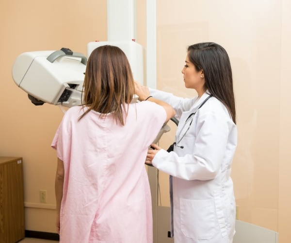 woman getting a screening mammogram