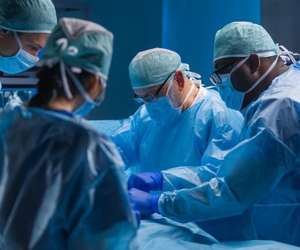 surgeons, patient in operating room