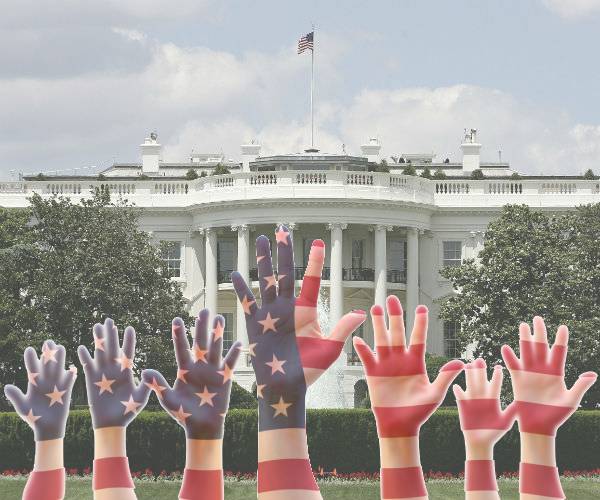 american flag pattern on people hands with the white house in the background