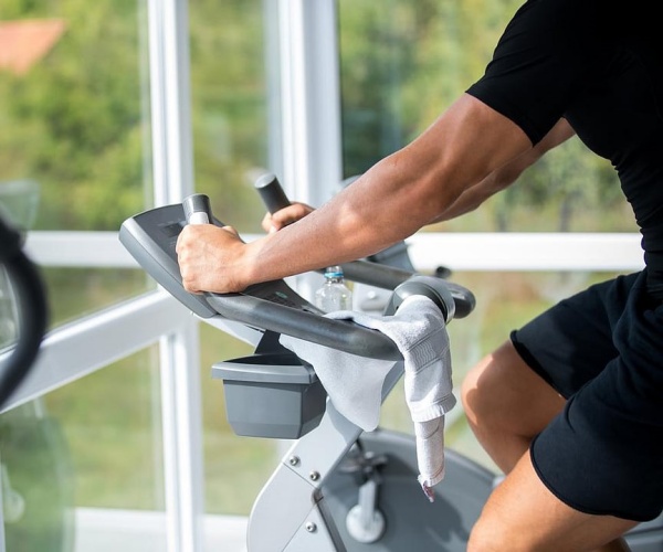 man on exercise bike at home