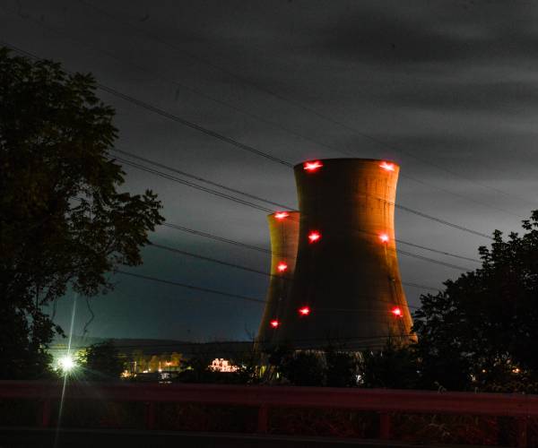 nuclear plant silos with lights shining so aircraft can see them in the dark