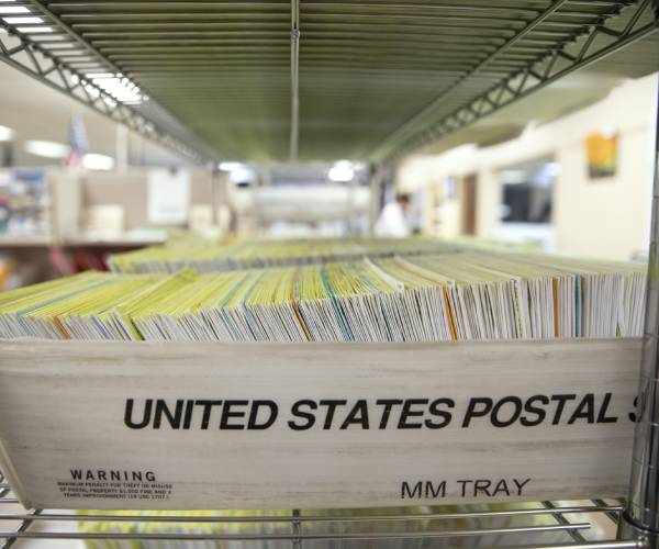 mail in ballots in a post office bin