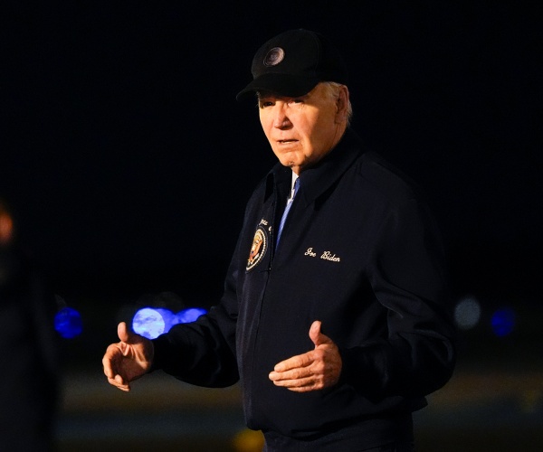 Biden walks to his car after getting off Air Force One.