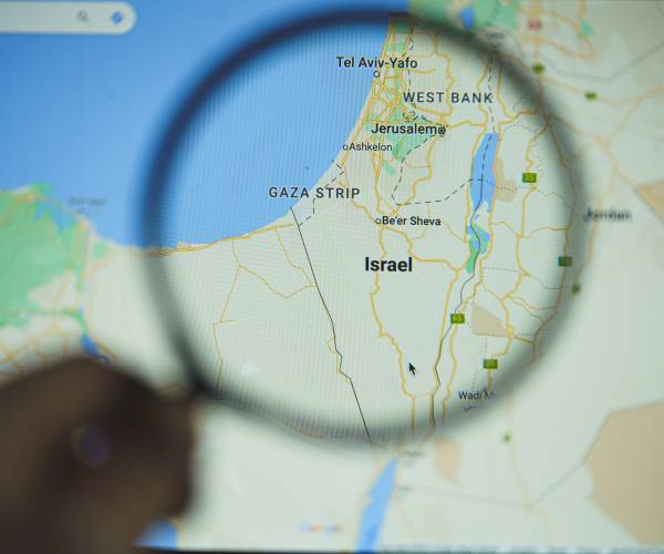 a map showing israel under a magnifying glass