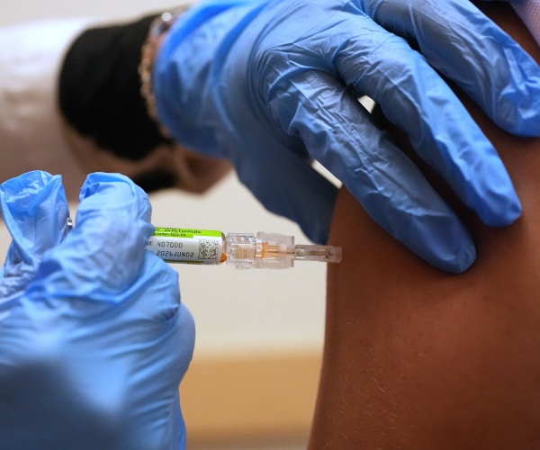 person getting flu vaccine