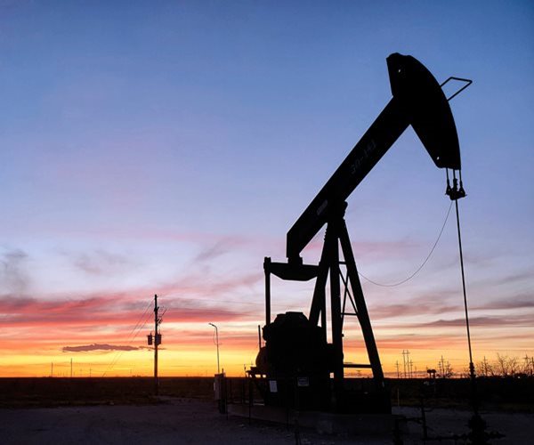 Oil Slides to $77 as Markets Cool
