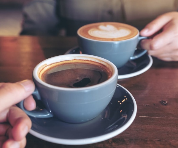 Two cups of coffee at a cafe