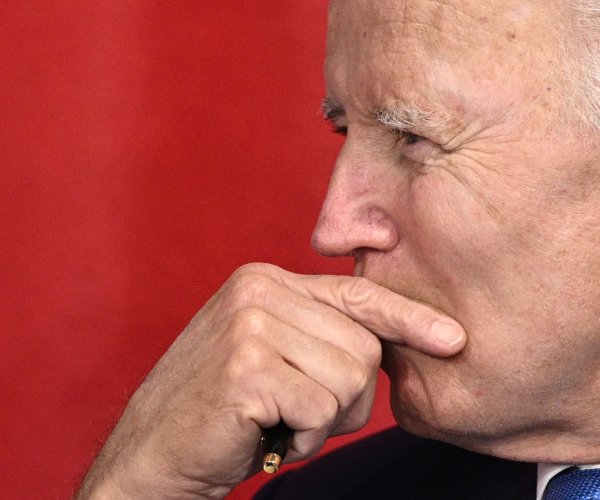 president joe biden looks on during a meeting