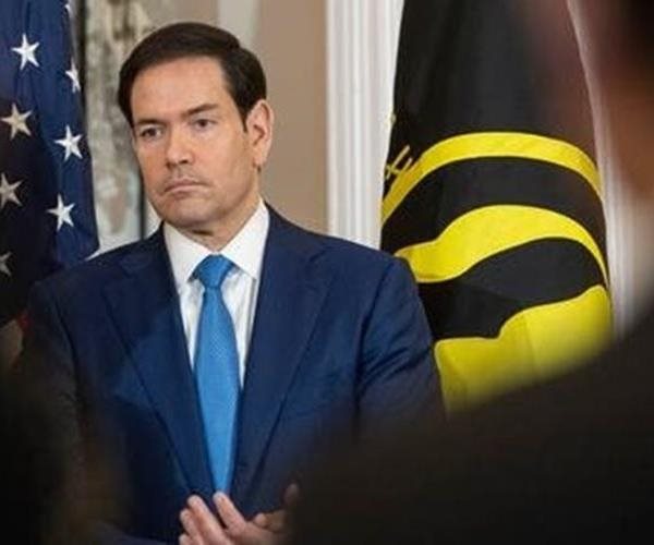 Marco Rubio looks on