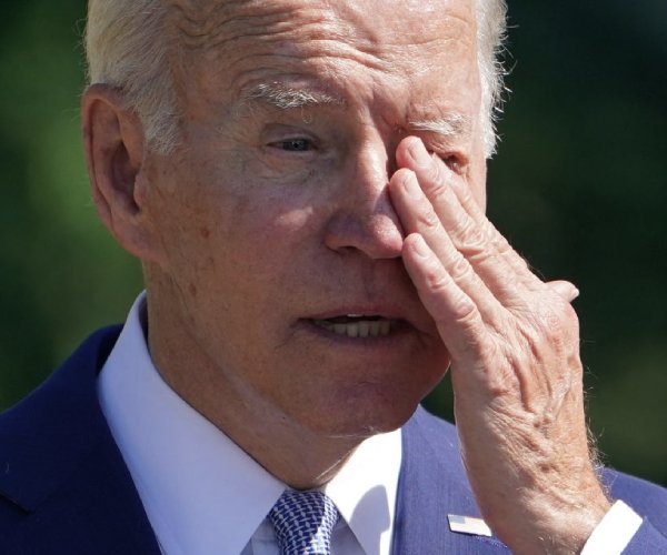 president joe biden wipes his eyes 