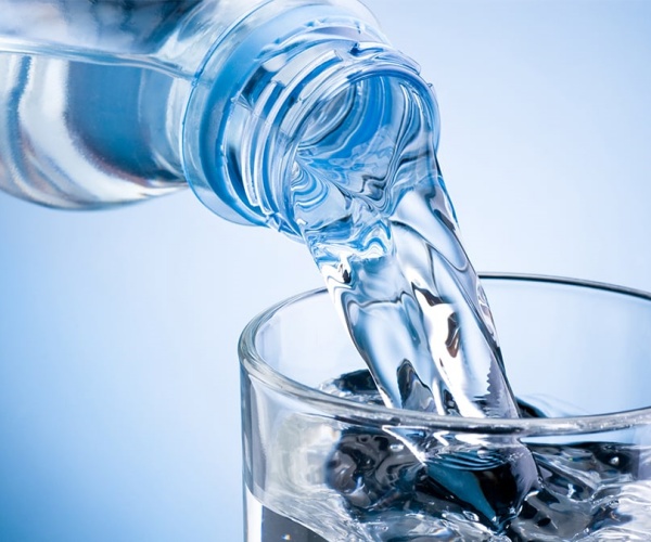 sparkling water being poured into a glass