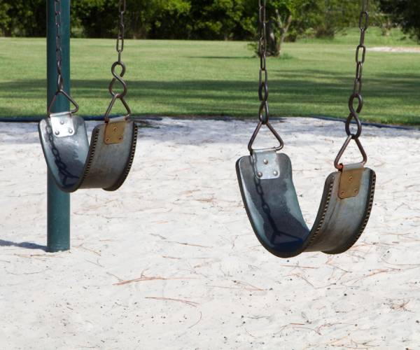 empty swings on a playground