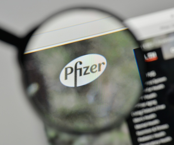 Pfizer logo from website under magnifying glass