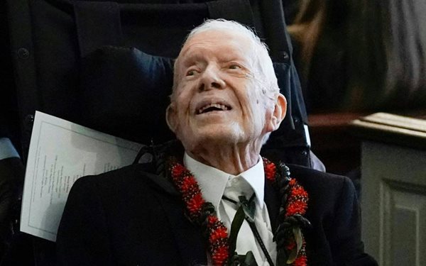 Former President Jimmy Carter looks off into the distance.