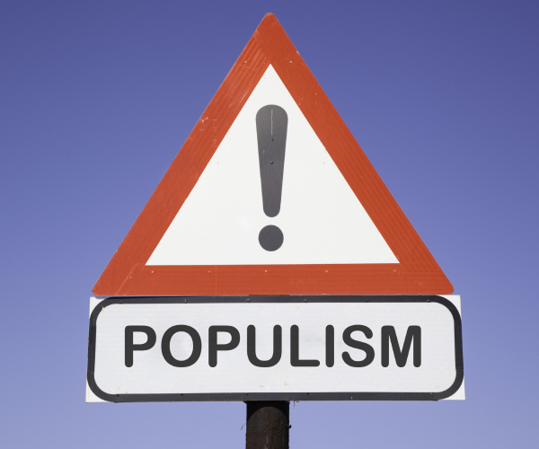 a warning street sign reading populism