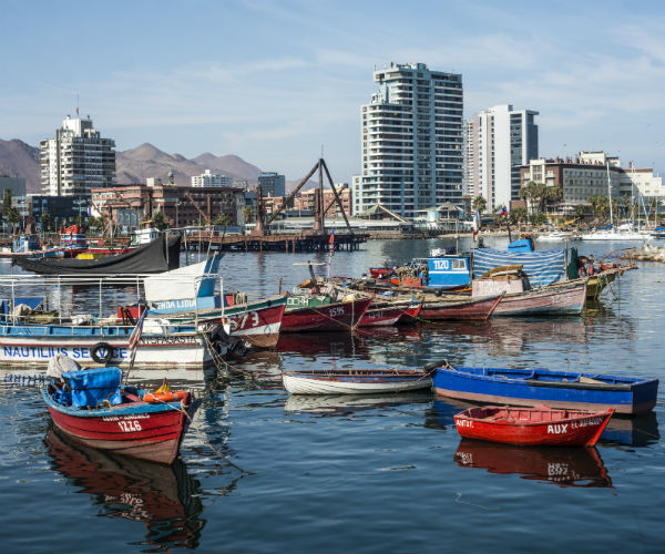 antofagasta chile where wooden fishing boats are in the harbor in the atacama region