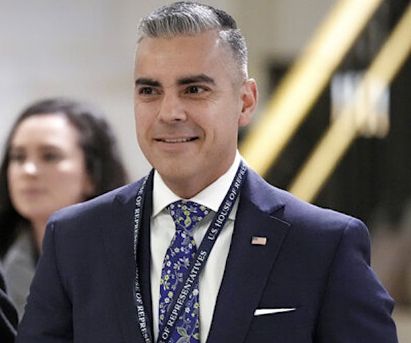 juan ciscomani walks through the halls of the state house