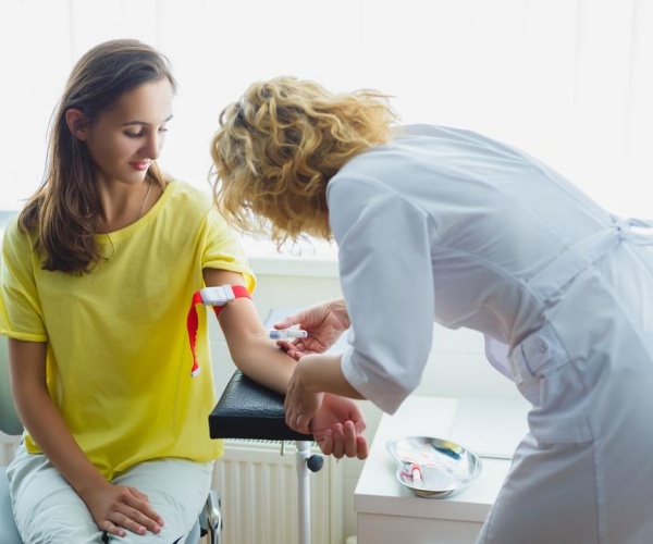 woman having her blood drawn for a test