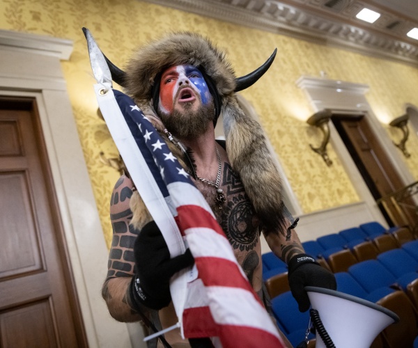 jacob chansley screams "freedom" inside the u.s. senate chamber