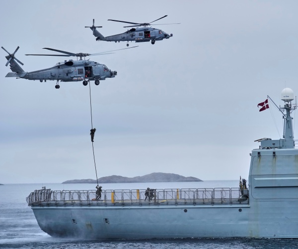 men drops from helicopters