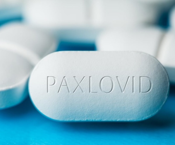 big white pill that says 'Paxlovid'