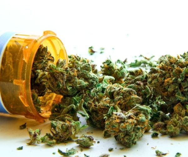 marijuana spilling out of prescription bottle 