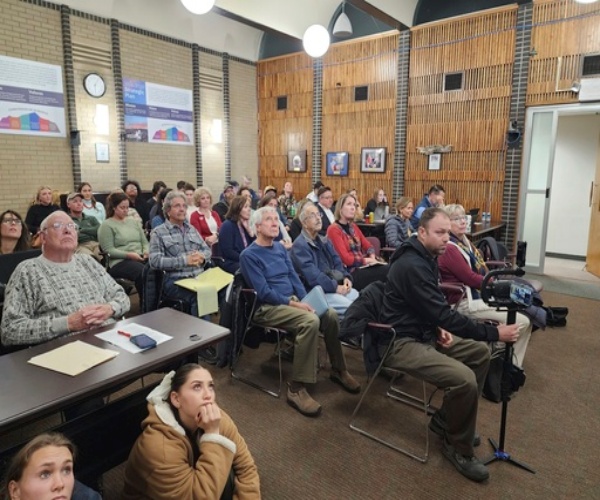 people in a town meeting discussing fluoride