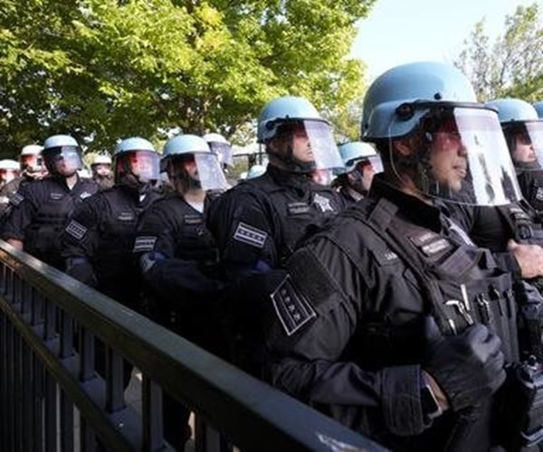 Rough Start: Protesters Tear Down Security Fence as Thousands March Outside DNC