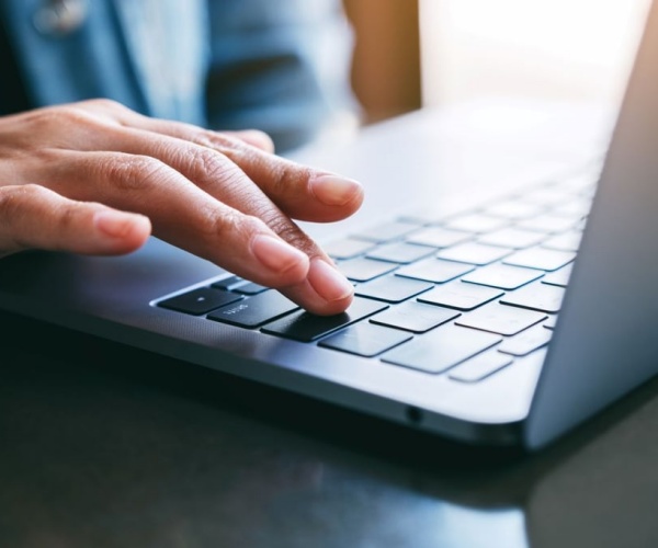 man on laptop, ordering online