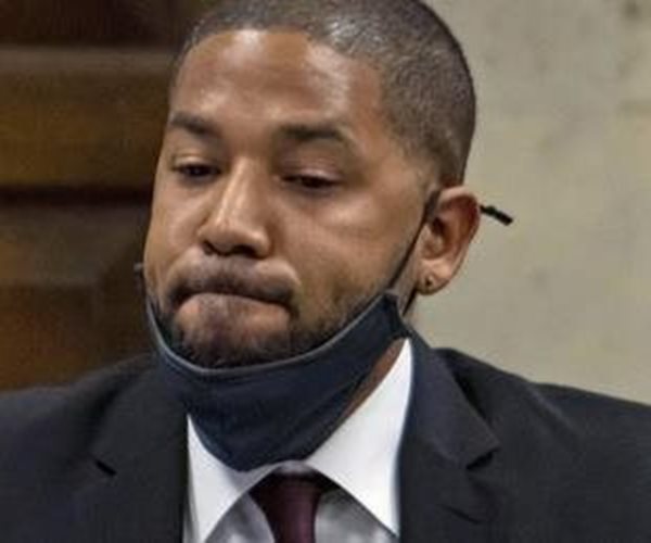 Jussie Smollett looks on