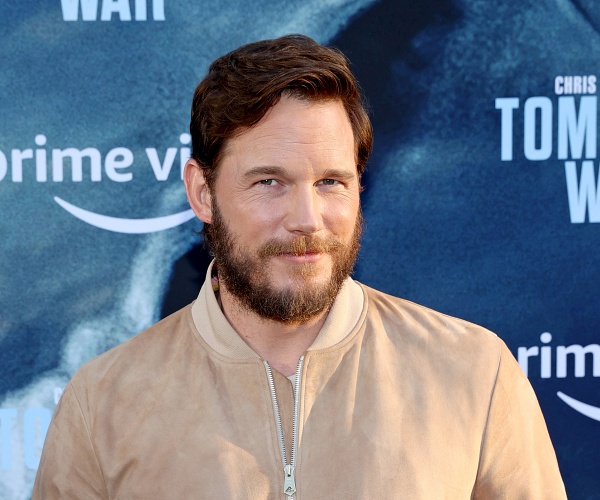 chris pratt stands on red carpet