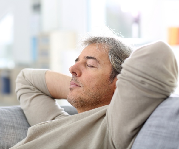 man napping on couch